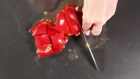 Tomato slicing grinds on gray background close-up top view Video stock 132598594