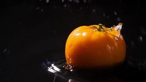 Tomato slow motion closeup falling in water with Splash Stock Footage 124798659