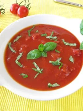 Tomato soup with basil Stock-Fotos