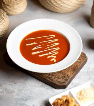 Tomato soup with sauce on the table Stock Photos