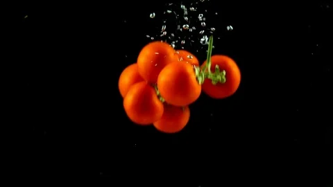 Tomato splash on the water in dark Stock Footage 124347216