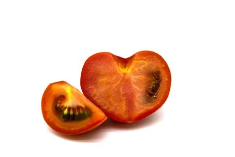 Tomato split into halves and quarters Stock Photos
