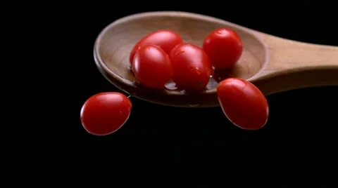 Tomato in spoon, Slow Motion Stock Footage 9292423