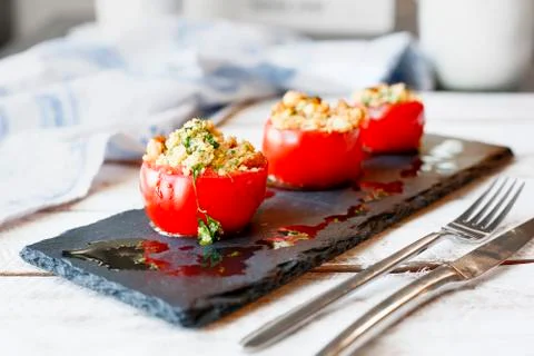 Tomato stuffed with couscous Stock Photos