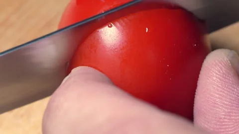 Tomato is tangible with Macro lens and divided into two Stock Footage 317822518