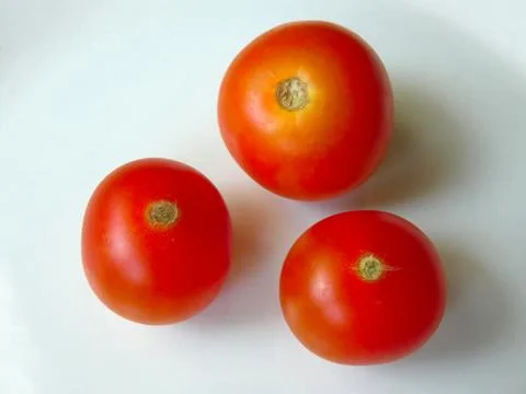 Tomato Three On Plate Stock Photos