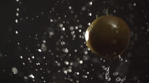 Tomato throw up with water splash droplets slow motion macro Stock Footage 124735837
