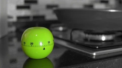 Tomato timer pomodoro / Cooking in kitchen - Pan Selective Color Selective Focus Stock Footage 129438438