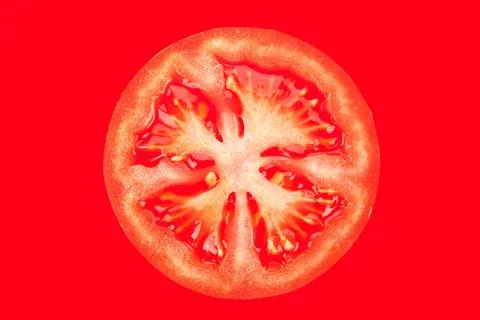 Tomato. Tomato slice isolated on red background. Duotone. Copyright: xZoon... Stock Photos