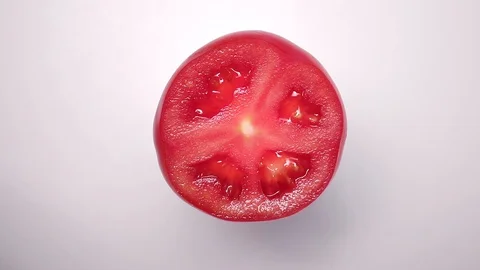 Tomato on the white background Stock Footage 128764283