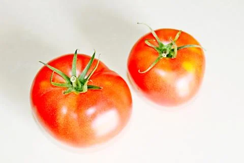 Tomato on a white background Stock Photos