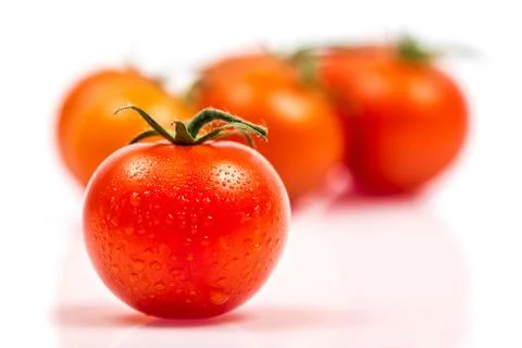 Tomato on white Stock Photos