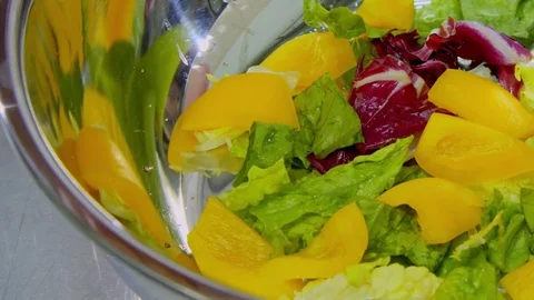 Tomatoes added to the salad Stock Footage 70986770