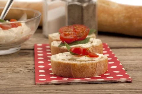 Tomatoes and basil on bread Stock Photos