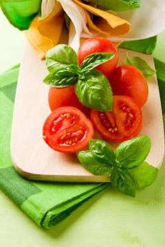 Tomatoes and basil Stock Photos