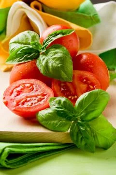 Tomatoes and basil Stock Photos