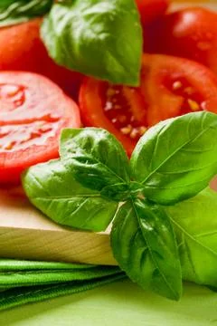 Tomatoes and basil Stock Photos