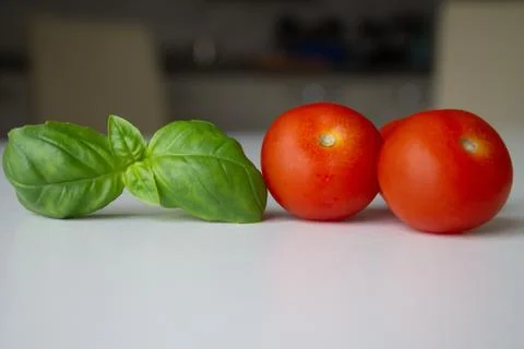 Tomatoes and basil Fotos de archivo