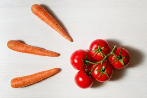 Tomatoes and carrots Stock Photos