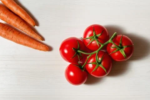 Tomatoes and carrots Stock Photos