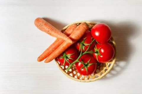 Tomatoes and carrots Stock Photos