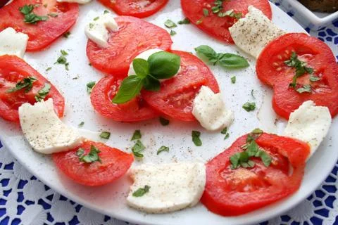 Tomatoes and cheese Stock Photos