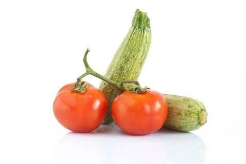 Tomatoes and courgettes Stock Photos