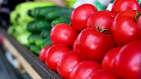 Tomatoes and cucumber on the stall, close up. Fresh, tasty and ripe Stock Footage 252818495