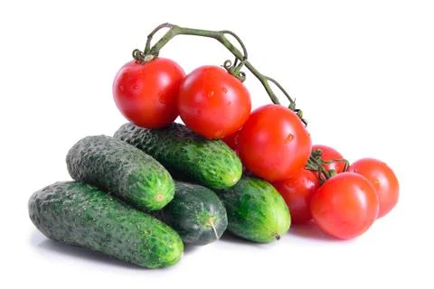 Tomatoes and cucumbers Stock Photos