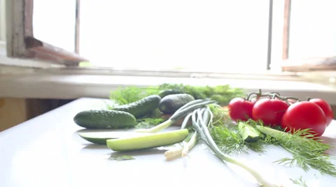 Tomatoes and cucumbers on the table in kitchen Vídeo Stock 39465540