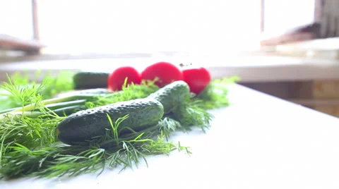 Tomatoes and cucumbers on the table in kitchen Stockbeeldmateriaal 40031274
