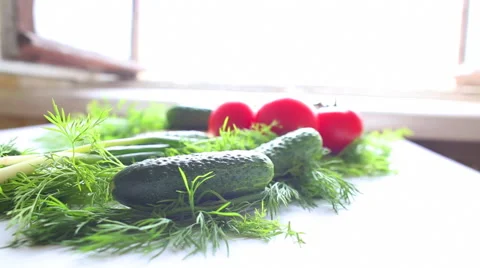 Tomatoes and cucumbers on the table in kitchen 스톡 동영상 40728565