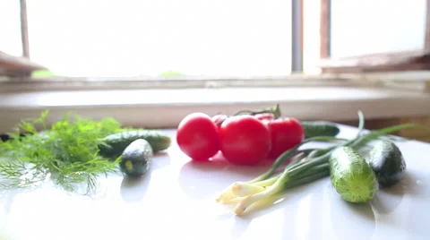 Tomatoes and cucumbers on the table in kitchen Stock-Footage 41601341