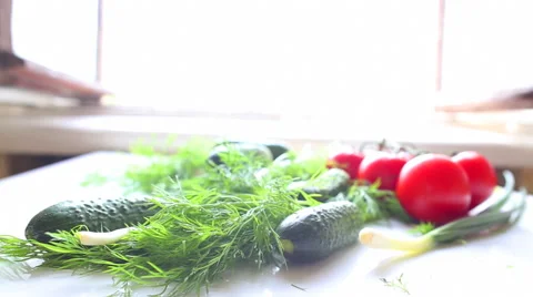Tomatoes and cucumbers on the table in kitchen Vídeo Stock 42369262
