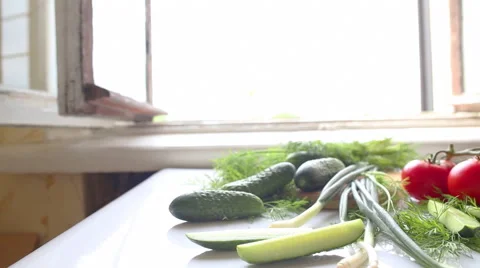 Tomatoes and cucumbers on the table in kitchen Vídeo Stock 42490507