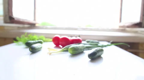 Tomatoes and cucumbers on the table in kitchen Stock Footage 42950888