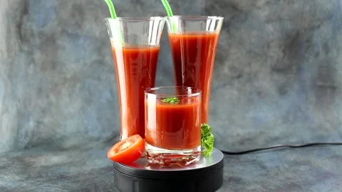 Tomatoes and a glass of tomato juice. Stock Footage