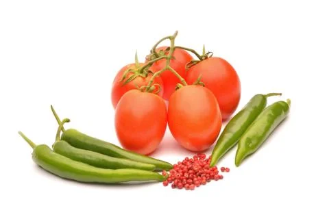 Tomatoes and hot chilli on background Stock Photos