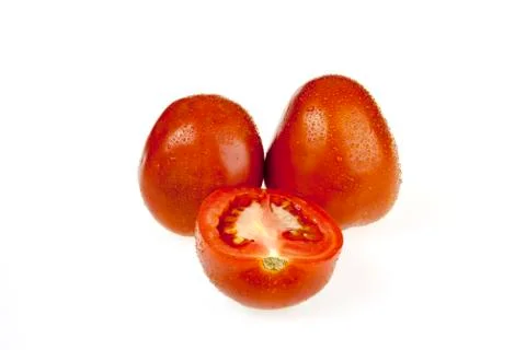 Tomatoes and slice Stock Photos