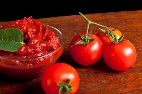 Tomatoes and tomato paste Stock Photos