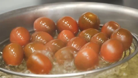 Tomatoes are cooking in the kitchen of the restaurant Stock Footage 114162753