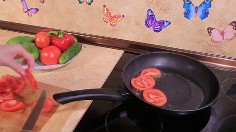 Tomatoes are fried Stock Footage 100989576