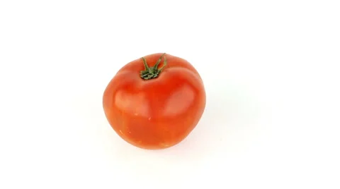 Tomatoes are rotated on a white background loop Stock Footage 40418123