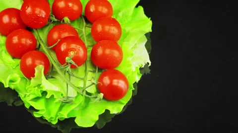 The tomatoes are on a salad leaf and ' round Stock Footage 39719969