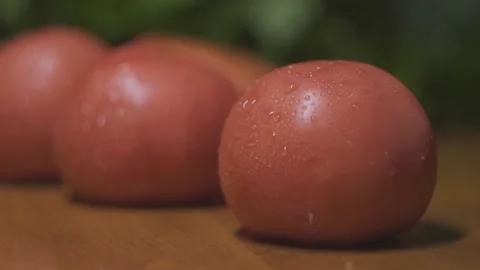 Tomatoes are on the table knife cuts vegetables Stock Footage 141187133