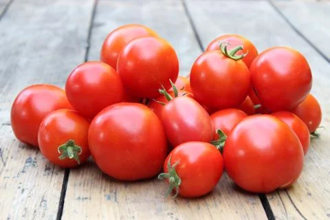 Tomatoes on background boards Stock Photos