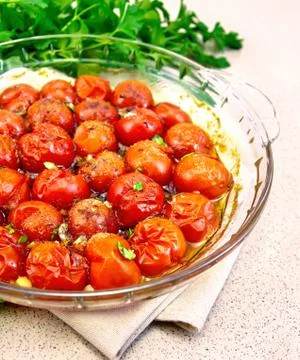 Tomatoes baked on granite table Stock Photos