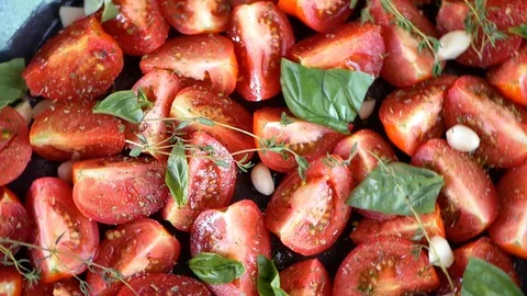 Tomatoes on a baking sheet. in front of the oven. No pesticides. Eco vegetables. Stock Footage 127754597