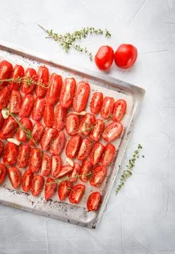 Tomatoes in baking tray Stock Photos