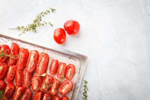 Tomatoes in baking tray Stock Photos